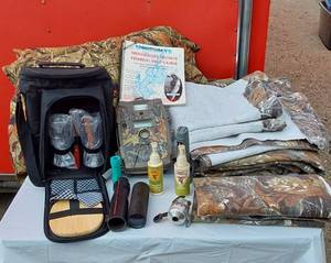lot 269 image: Muskie Fishing Guide, Camo Material, Older Game Camera, Soft Side Cooler with Cups