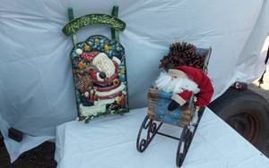 lot 312 image: Holiday Decor including Santa Wall Hanging Sled and Sleigh with Pinecones