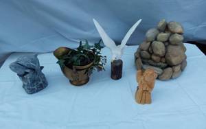 lot 339 image: Lot of Decorative Items Including Gold Vase with Ivy, White Bird Sculpture, Stone Fountain, and Wood Carving