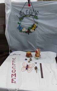 lot 382 image: Welcome Sign with Butterfly Design, Santa Figurine, and Assorted Decorative Items