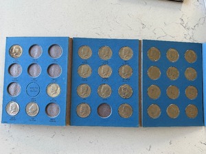 lot 55 image: Kennedy Half Dollars and Book