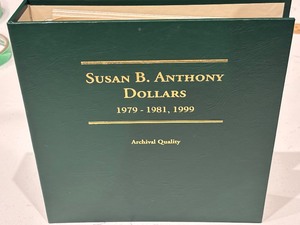 lot 152 image: Susan B. Anthony Dollars and Book