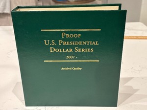 lot 153 image: Presidential Dollars and Book