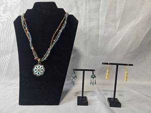 lot 69 image: Jewelry Lot with Beaded Pendant Necklace, Faux Pearl Necklace, and 2 Pairs of Earrings - displays not inc