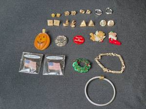 lot 124 image: Assorted Costume Jewelry and Pin Collection including Bracelets, Holiday Pins, and Earrings - Inc Avon