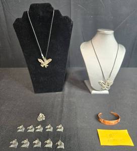 lot 132 image: Collection of Eagle-Themed Jewelry and Charms Including Copper Bracelet - display not inc