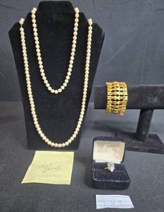 lot 136 image: Faux Pearl Necklaces (1928 & Trifari), Gold Tone Bracelet, and Size 9 Pear-Shaped Ring in Box - display not inc