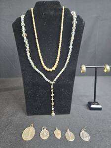 lot 174 image: Vintage Costume Jewelry Lot with Necklaces, Earrings, Religious Medals, and Brooch - displays not inc