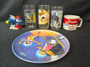 lot 267 image: Vintage Cartoon & Advertising Collectibles Lot Glasses, Plate, Mug, Smurfs Figurine