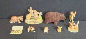 lot 274 image: Collection of Animal Figurines Including Deer, Rabbits, Bear, and Raccoon