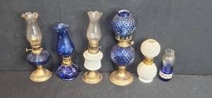 lot 276 image: Collection of Vintage Blue and White Glass Oil Lamps