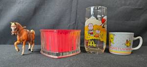 lot 292 image: Mixed Collectibles Lot with McDonalds Peanuts Glass, Sesame Street Mug, Horse Figurine, and Clear Glass Heart Dish w Red Insert