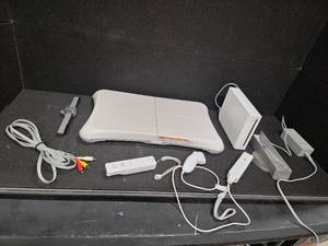 lot 3023 image: Nintendo Wii console with a Wii Balance Board and various accessories