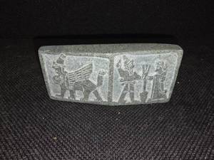 lot 3084 image: Cambodian stone artifact depicting carvings of an ancient race.