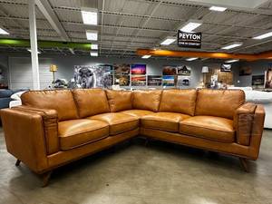 lot 2 image: NEW IN BOX Maddox Mid-Century Sofa  Cognac Faux Leather  Fully Padded, Easy-Clean, 5th Support Leg