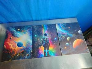 lot 19 image: Three-Panel Canvas Wall Art Set Featuring an Astronaut and Celestial Bodies