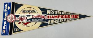lot 106 image: Vintage 1987 Minnesota Twins 12 x 30 Western Division Champions Pennant, Bumper Sticker And Button