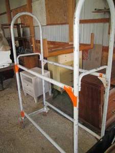 lot 505 image: Metal framed portable tire rack on ...
