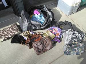 lot 529 image: Massive rolling duffle bag full of ...