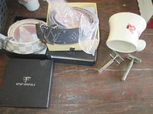 lot 548 image: Mens new belts, ceramic mug and vi...