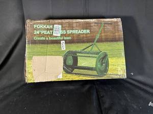 lot 32 image: Fokkah 24 Inch Peat Moss and Compost Spreader