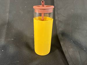 lot 47 image: Glass Tumbler with Yellow Silicone Sleeve and Straw
