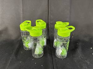 lot 65 image: Lot of 5 Plastic Water Bottles with Green Lids