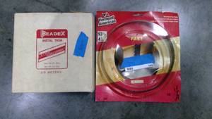 lot 105 image: Band saw blade and metal trim