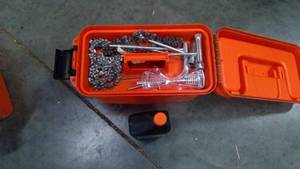 lot 303 image: Chainsaw items and box