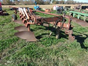 lot 18 image: International 710 4 Bottom Semi Mount Plow