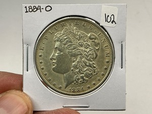 lot 102 image: 1884-O Morgan Silver Dollar