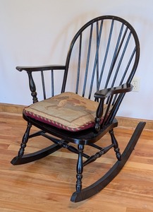 lot 202 image: UL - Black Wooden Vintage Windsor Rocking Chair with Golf Motif Cushion