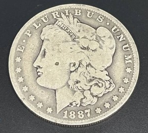 lot 25 image: 1887-O Morgan Silver Dollar