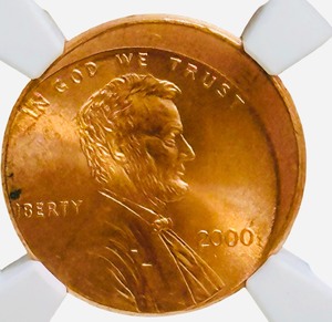COIN NGC Certified 2000 1c  ERROR Struck Off Center  2000 Lincoln Cent graded as a Struck Off Center mint error by the Numismatic Guaranty Company (NGC)