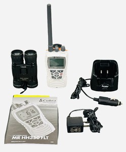 Cobra MR HH350 FLT Handheld Floating VHF Marine Radio includes a pair of Celestron 12x25 binoculars
