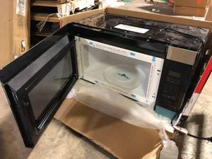 lot 23 image: Amana Microwave Hood Combination Customer Returns See Pictures