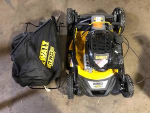 lot 62 image: DEWALT 21 in. 163cc Briggs and Stratton 725Exi Engine Rear Wheel Drive 3-in-1 Gas Self Propelled Walk Behind Lawn Mower     Customer Returns See Pictures See Pictures
