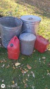 lot 22 image: Lot of 3 Metal Trash Cans and 2 Red Plastic Fuel Containers