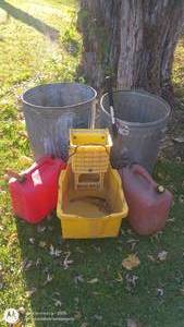 lot 21 image: Group of Outdoor Utility Items with Trash Cans, Gas Cans, and Storage Bin