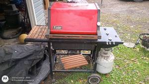 lot 54 image: Weber 3-Burner Propane Gas Grill with Red Hood and Side Shelves