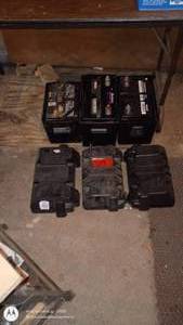 lot 69 image: Set of 3 Used Automotive Batteries with Cases