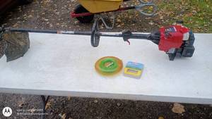 lot 95 image: Troy-Bilt Gas String Trimmer with Fuel Line and Spool