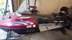 lot 102 image: Polaris Indy Sport Snowmobile with Custom Patched Seat