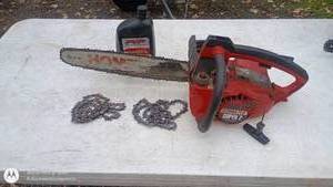 lot 105 image: Homelite Super 2 Chainsaw with Extra Chains and Bar Oil