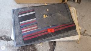 lot 128 image: Set of 4 Used Floor Mats Assorted Styles and Sizes