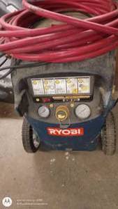 lot 138 image: Ryobi Portable Air Compressor with Long Red Hose