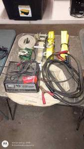 lot 140 image: Battery Charger, Jumper Cables, Tow Straps, and Tie-Downs Lot