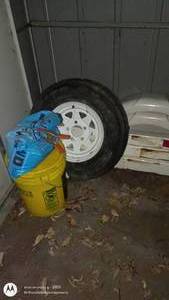 lot 155 image: Trailer Spare Tire, White Fender, and Utility Case Set