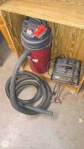 lot 159 image: Shop-Vac WetDry Vacuum with Hose and Schumacher 21050 Amp Battery Charger