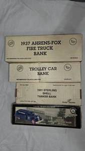 lot 225 image: Lot of 4 Diecast Coin Banks
